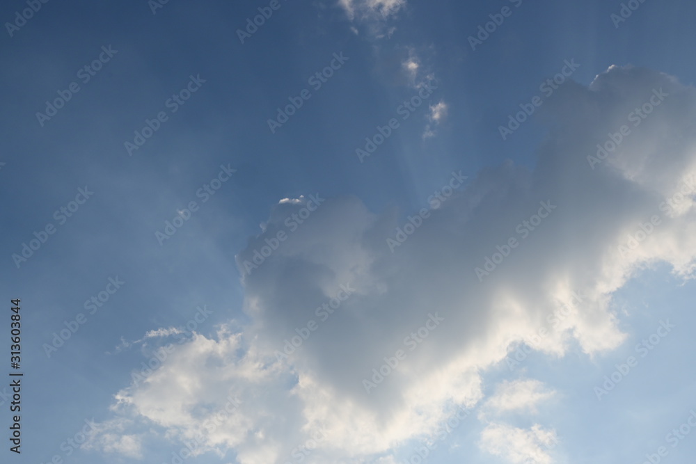 fluffy cloud above blue sky with sunlight in the morning fluffy cloud above blue sky with sunlight in the morning