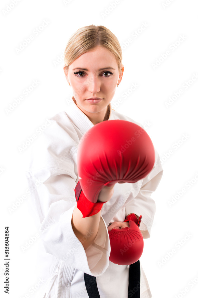 Girl in kimono for karate and boxing gloves Girl in kimono for karate and boxing gloves