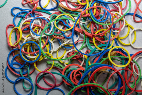 colored rubber bands on a table