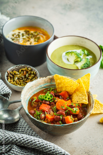 Set of vegan soups. Mexican bean soup, broccoli cream soup and mashed pumpkin soup.