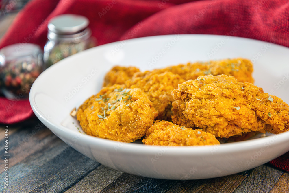 Chicken Wings Spicy chicken wings, breaded, fried, cooked. Chicken Wings Spicy chicken wings, breaded, fried, cooked.