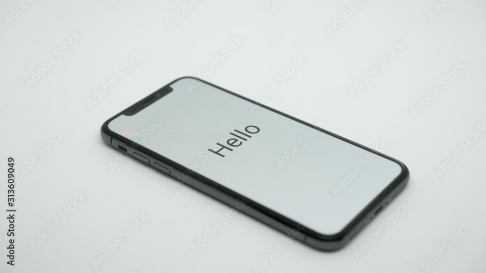 Smartphone slide to center and start screen with word Hello in white background Smartphone slide to center and start screen with word Hello in white background