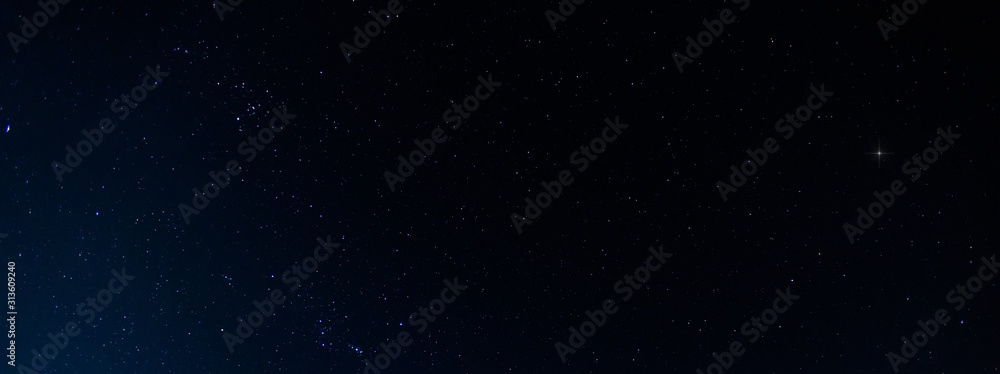 Panorama blue night sky milky way and star on dark background.Universe filled with stars, nebula and galaxy with noise and grain.Photo by long exposure and select white balance.selection focus.amazing