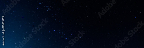 Panorama blue night sky milky way and star on dark background.Universe filled with stars  nebula and galaxy with noise and grain.Photo by long exposure and select white balance.selection focus.amazing