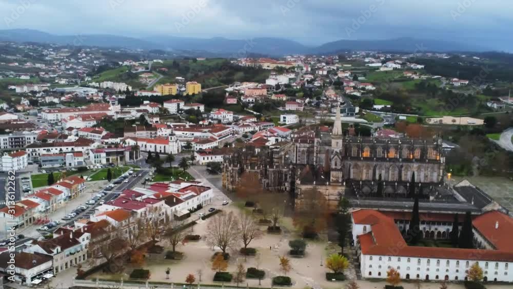 Aerial view of the cathedral and the city of Batalha, Portugal, pan left. World Heritage Site Aerial view of the cathedral and the city of Batalha, Portugal, pan left. World Heritage Site