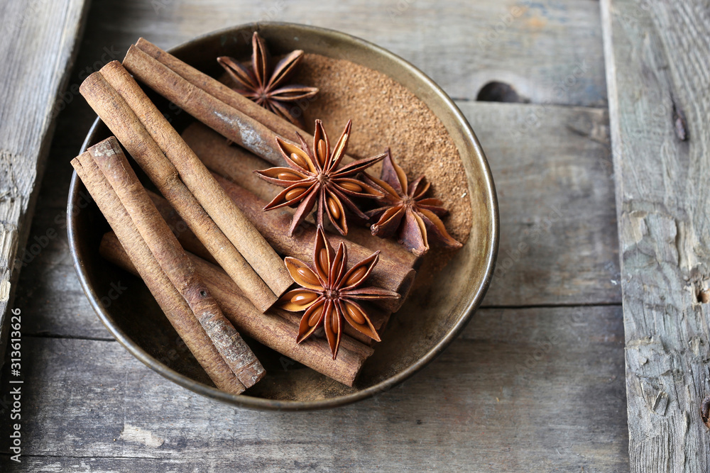 Cinnamon and anise on wooden background Cinnamon and anise on wooden background