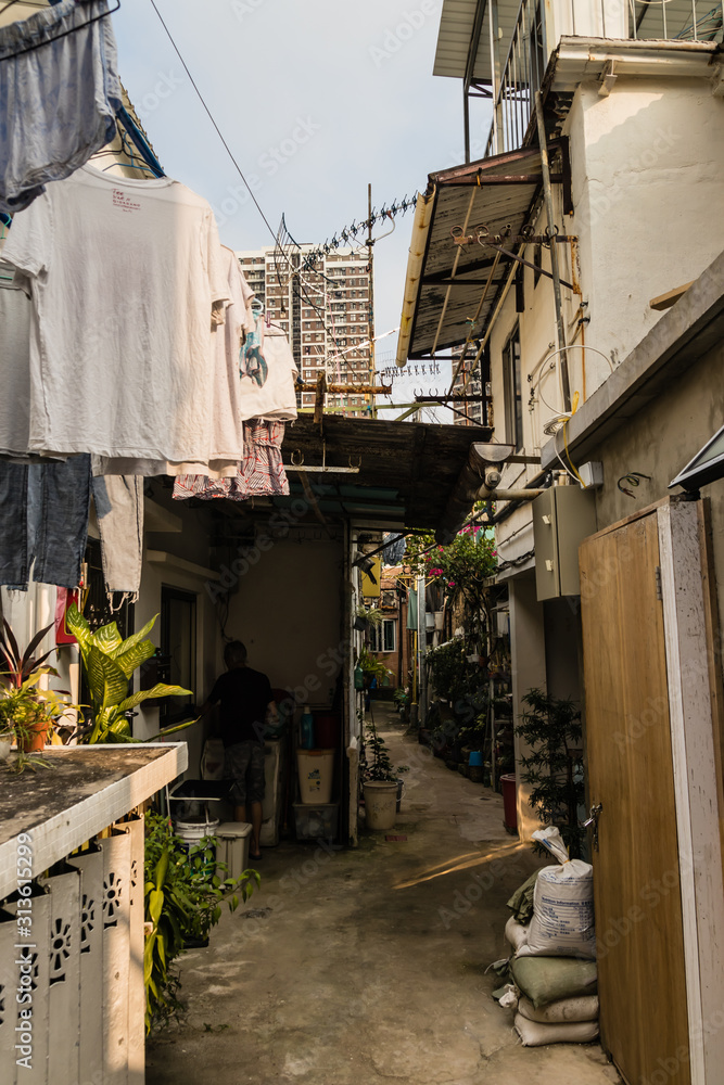A narrow street in Pokfulam Village, Hong Kong A narrow street in Pokfulam Village, Hong Kong