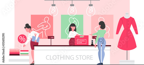 Clothing store interior. Woman standing at the counter in the clothing store