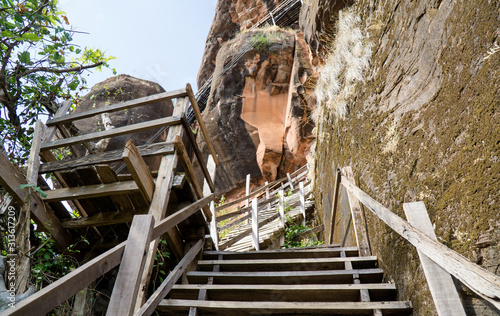 View of a wooden walkway that stretches along the cliffs of Jetiyakiri Temple (Phu Thok Temple) in Bueng Kan Province. photo