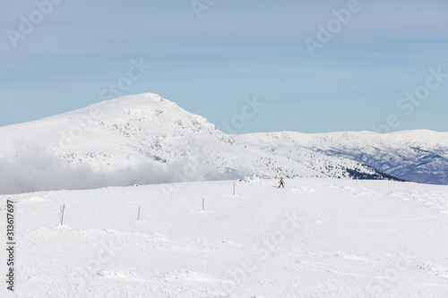 Off-piste skier in the Sierra de Guadarrama in Madrid, Spain, covered by snow.