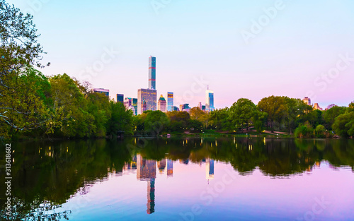 Pond at Central park New York  great design for any purposes. Midtown Manhattan  USA. View with Skyline of Skyscrapers architecture in NYC. Nature background. Urban cityscape. NY  US
