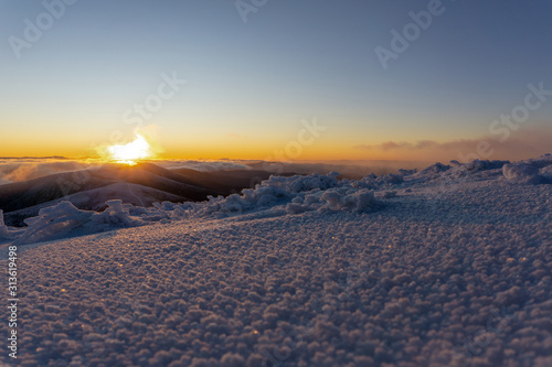 Beautiful panoramic view of sunrise in winter carpathians. Borzhava ridge. Ukraine