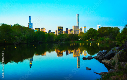 Pond at Central park New York, great design for any purposes. Midtown Manhattan, USA. View with Skyline of Skyscrapers architecture in NYC. Nature background. Urban cityscape. NY, US