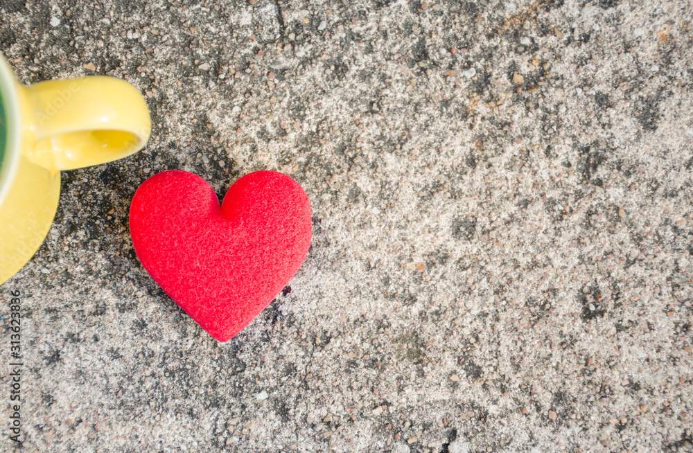 Valentines day background with a red heart with a yellow glass Valentines day background with a red heart with a yellow glass
