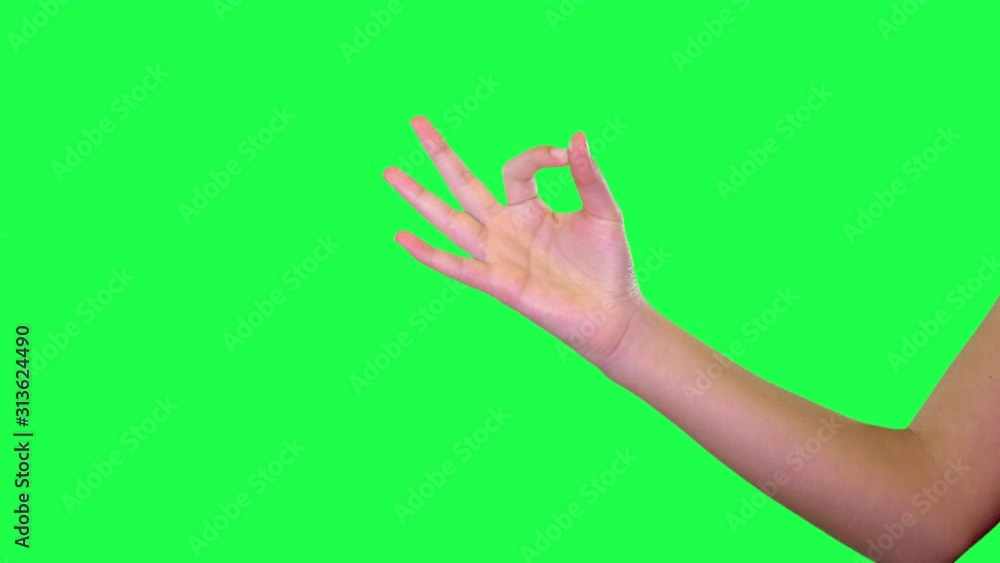 OK hand sign of young girl over green screen OK hand sign of young girl over green screen