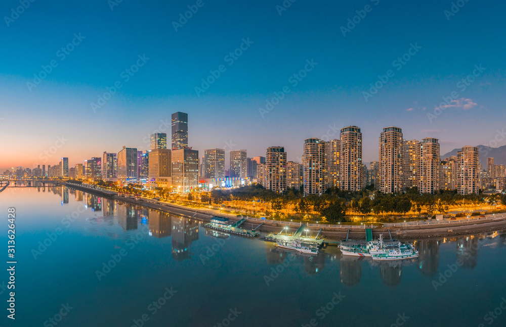 Obraz premium Urban night view of CBD of strait financial street and CBD of jiangnan district, fuzhou city, fujian province, China