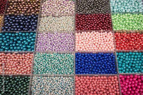 Beads in boxes multi-colored of different sizes and styles sold n local market in Greece