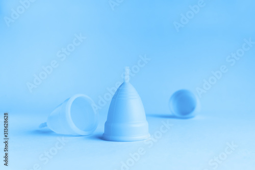 Menstrual cup on pink background. Alternative product