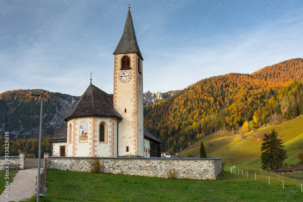Idyllic scenery of the small church in the Alps mountains, Italy