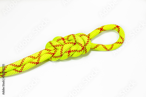 double Flemish loop or figure eight 8 knot or spider hitch use for attaching rope to climbing harness and create a mustache self insurance and attach a carabiner to them. Isolated on white background
