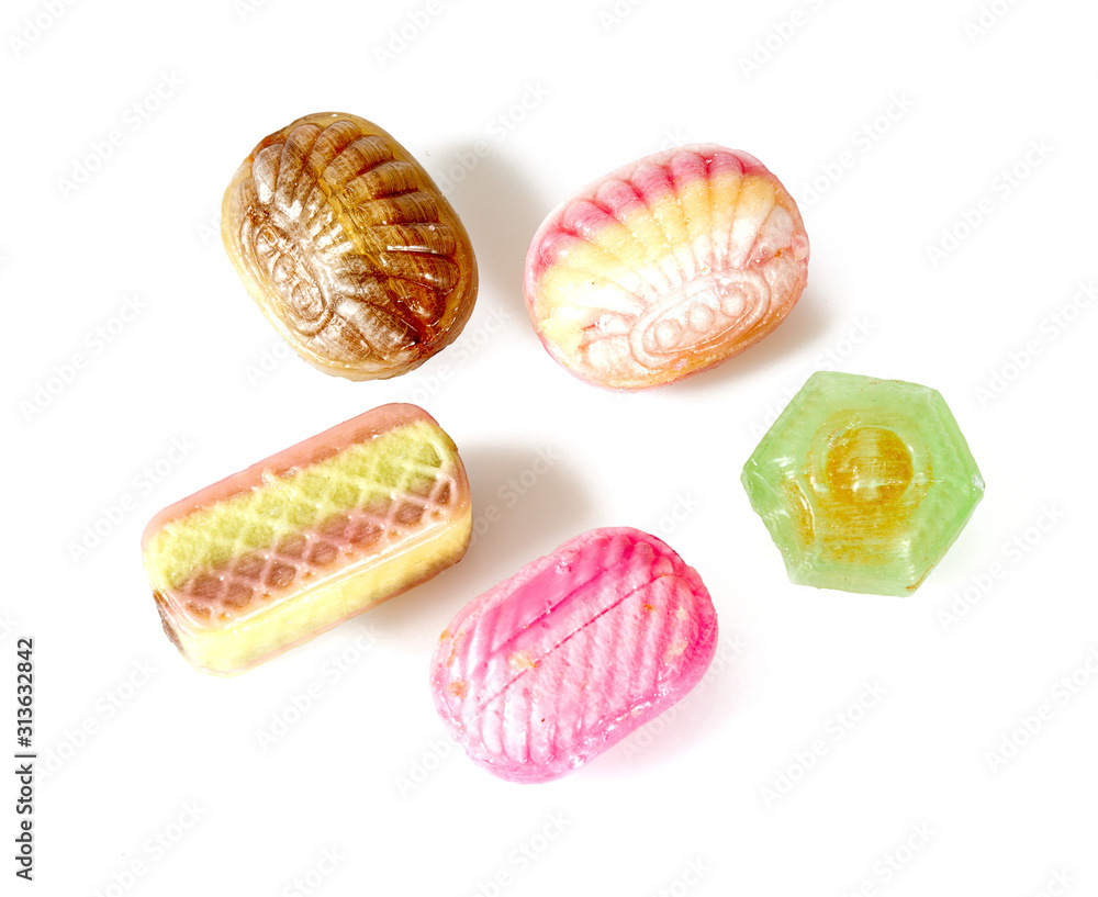 assortment of caramel candies isolated on white assortment of caramel candies isolated on white