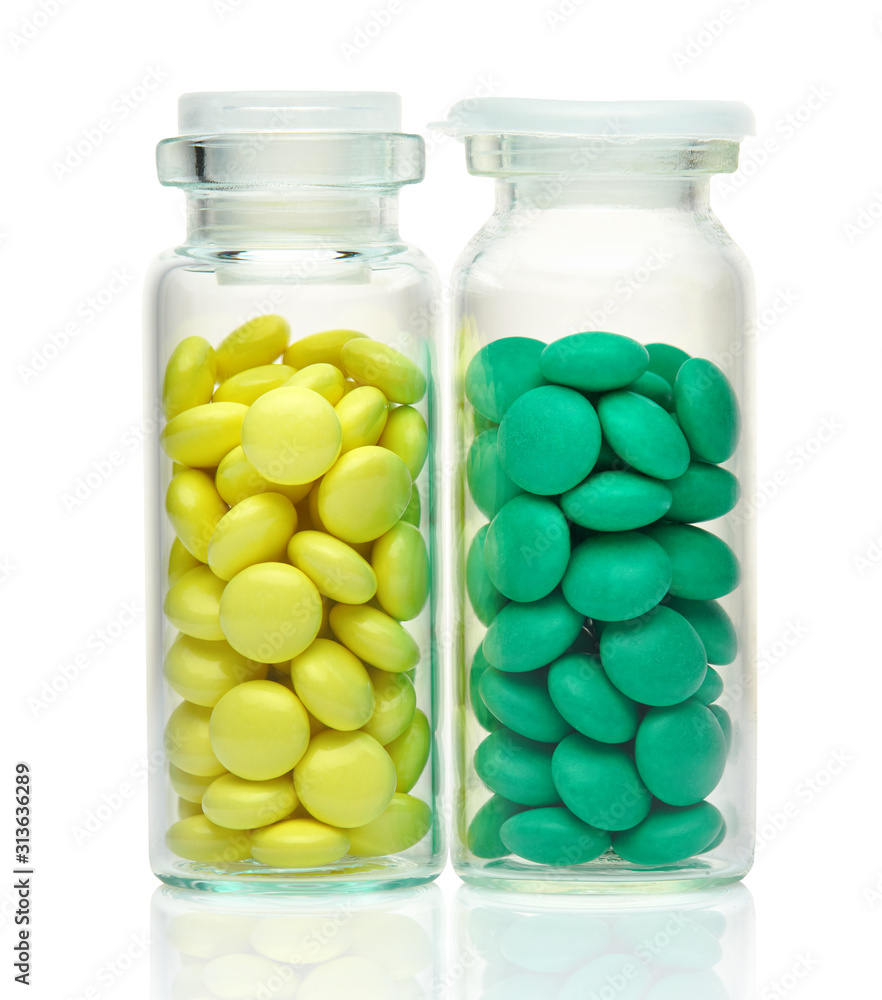 Valerian root extract and motherwort, herbal pills, tablets in a glass bottle. Medicinal product for sedation, natural herbs for relaxing the nervous system. Health care and good sleep.