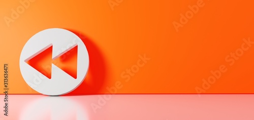 3D rendering of white symbol of rewind  icon leaning on color wall with floor reflection with empty space on right side photo