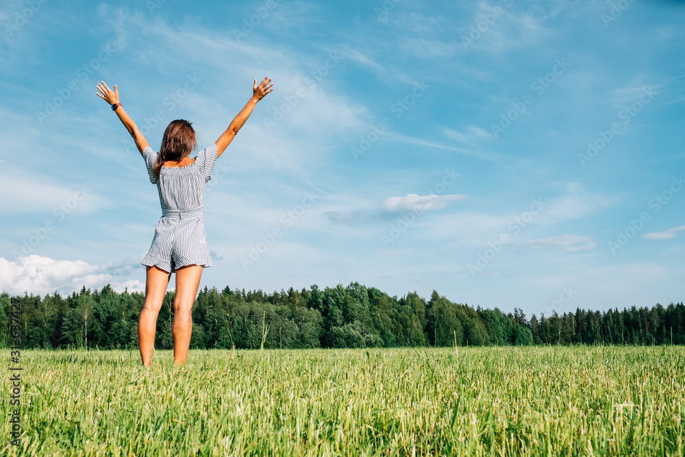 Beautiful girl in dress on green field Beautiful girl in dress on green field