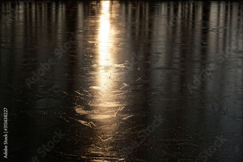 Light reflection on a frozen lake surface