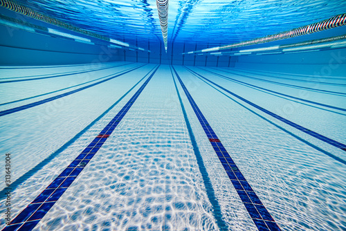 Olympic Swimming pool under water background.