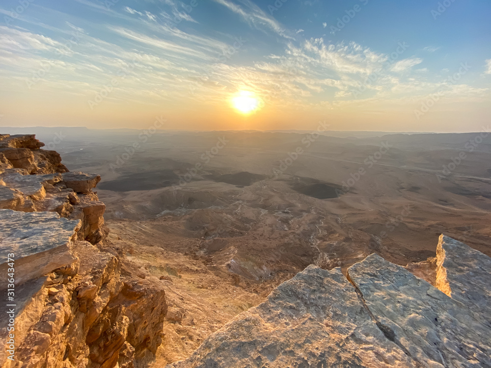 Naklejka premium Sunrise in Negev Desert. View of the Makhtesh Ramon Crator at Mitzpe Ramon, Sothern Negev, Israel.
