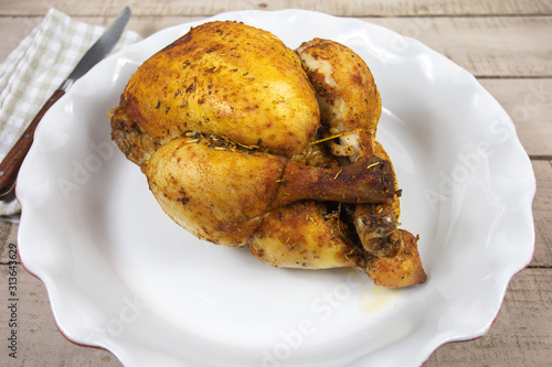whole roast chicken in a dish