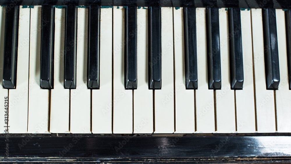 Old piano keyboard background with selective focus Old piano keyboard background with selective focus