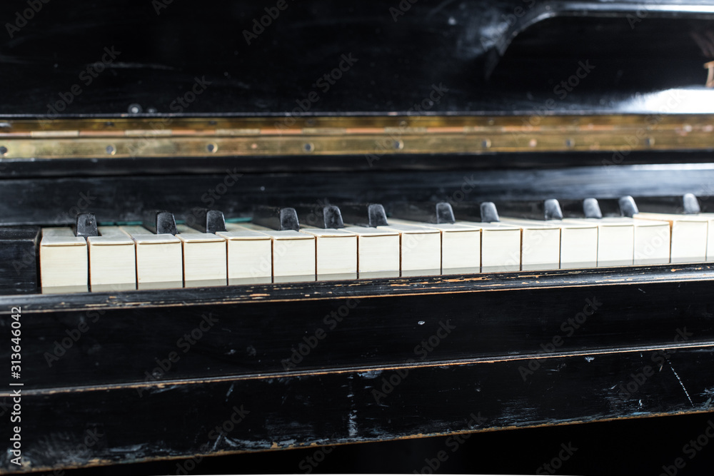 Old piano keyboard background with selective focus Old piano keyboard background with selective focus