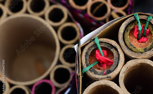 Canvas Print Close-up and top view of partially burned-down fireworks that are left after the