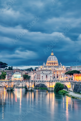 Illuminated St. Peter's Cathedral in Rome at Dusk