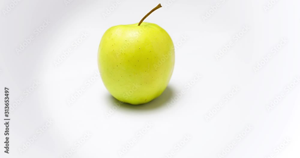 Camera moving around one yellow apple isolated on white background Camera moving around one yellow apple isolated on white background