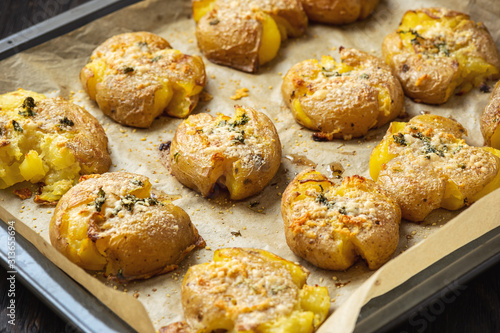Crispy smashed potatoes roasted with garlic and parmesan. 