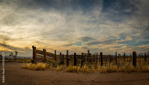 Panorama of an old western corral in the desert of Arizona in late afternoon light.