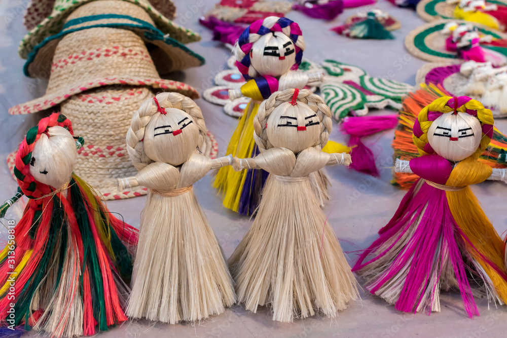 Colourful decorative wall hangings, dolls made of jute, handicrafts for sale (Selective Focus)