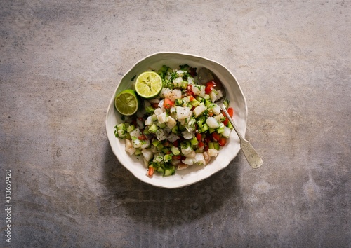 Overhead view of cod ceviche served in bowl