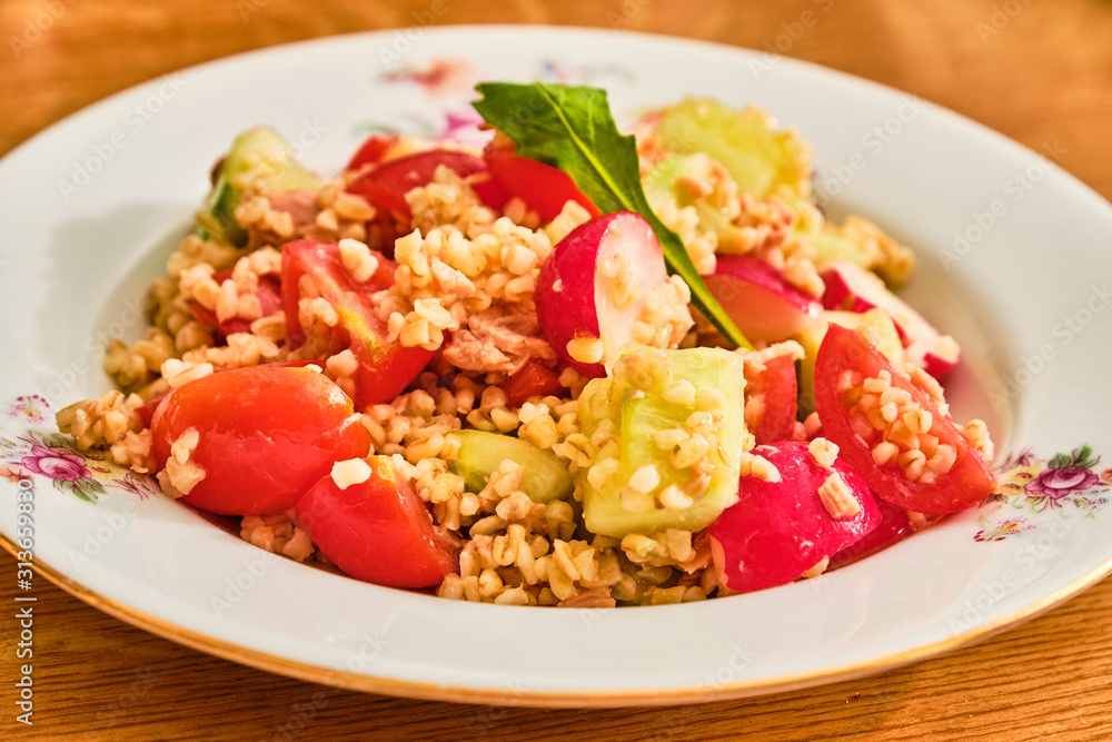 Bulgur salad on white plate Bulgur salad on white plate