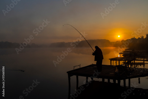 fisherman on Jenoi pond near Diosjeno, Northern Hungary