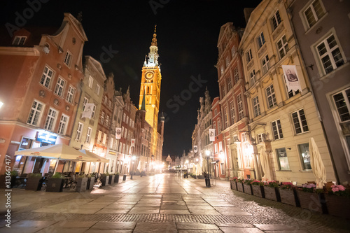 Gdansk, Poland - Juny, 2019. Beautiful historic houses and Golden Gate on Long Lane in Gdansk Old Town at night, Poland