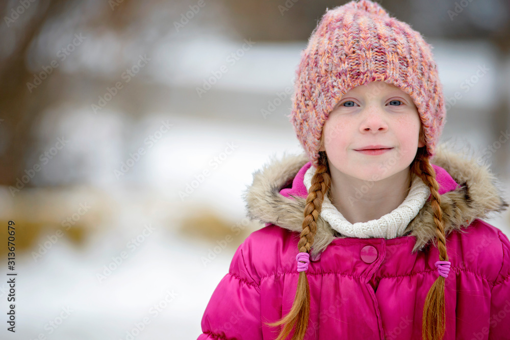 Little Girl With Red Hair Outdoors in Winter Little Girl With Red Hair Outdoors in Winter