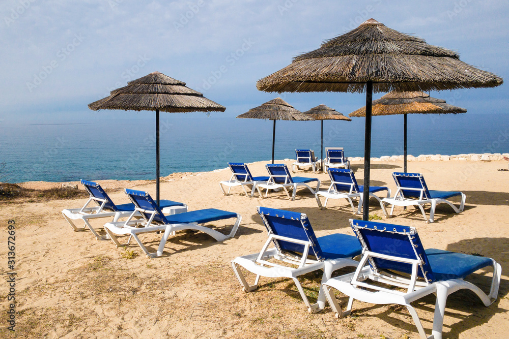 Beach loungers on the background of the sea and sky,summer vacation