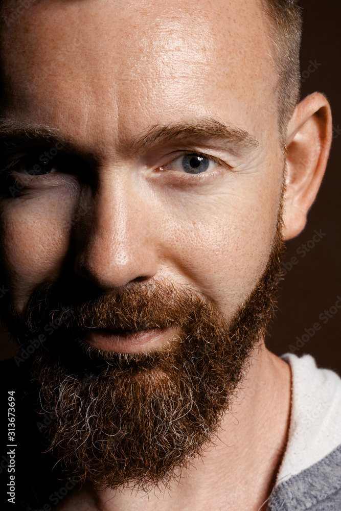 Fototapeta premium brutal man with a beard in the studio