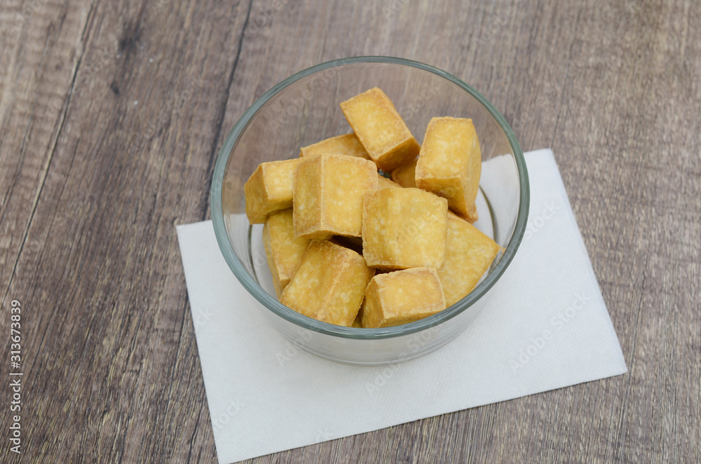 Fried cubes of bean curd (tofu) in glass bowl Fried cubes of bean curd (tofu) in glass bowl