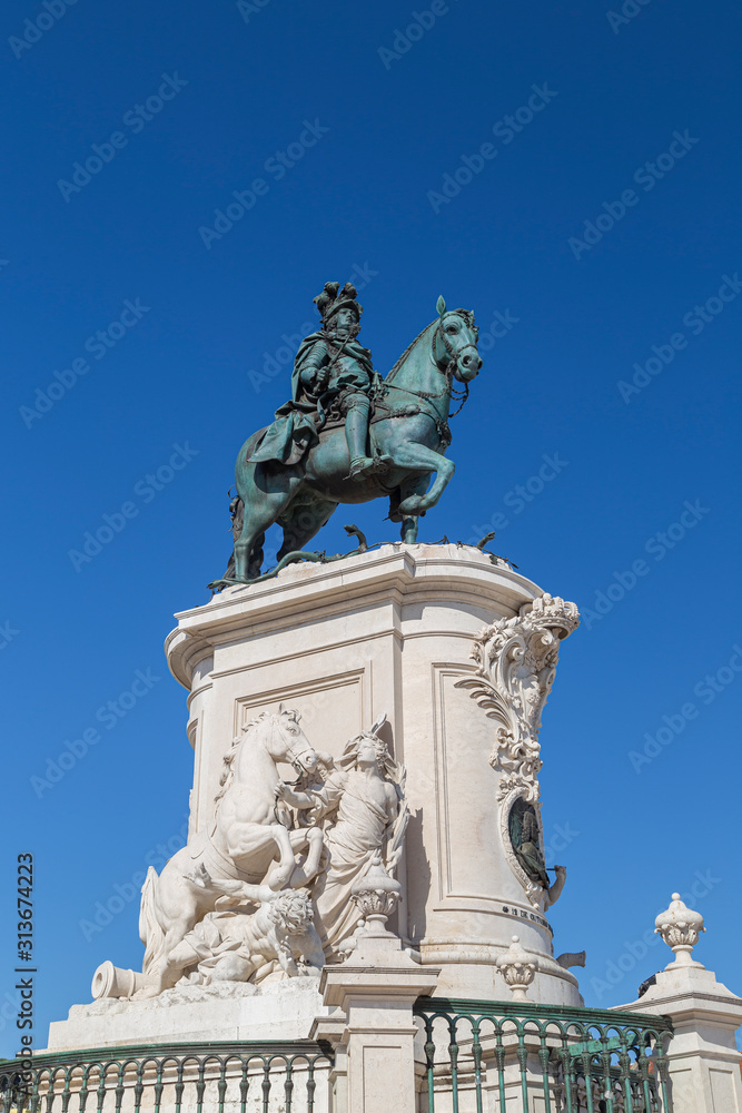 Statue of King Jose I at the Praca do Comercio square in Baixa district in Lisbon, Portugal, on a sunny day.