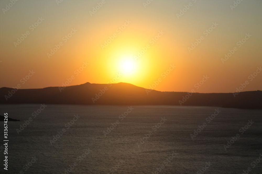 Sunset over the island of Nea Kameni as seen from Santorini